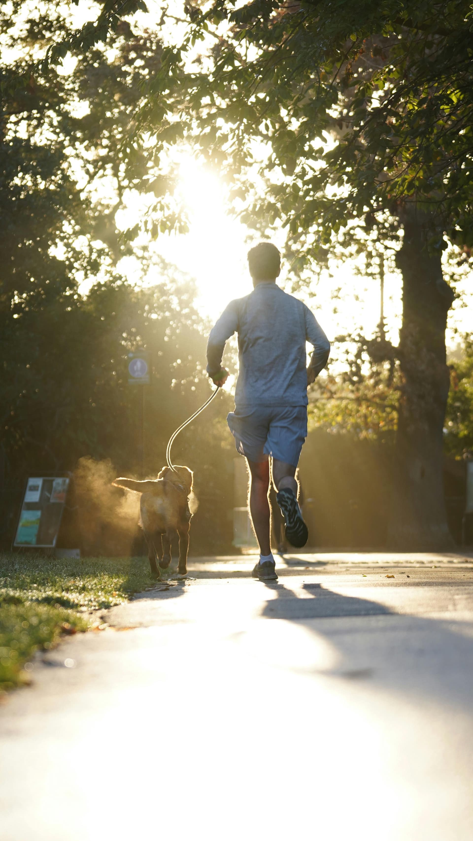Man jogging with dog